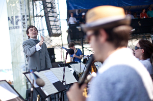 Sharply dressed for the occasion, composer Darcy James Argue led his 18-piece big band, Secret Society, at the main Fort Stage on Saturday.
