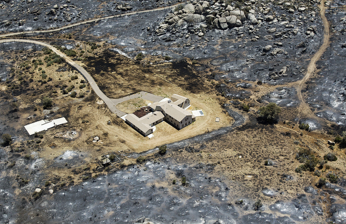 This aerial photo from July 3 shows Yarnell, Ariz., after the Yarnell Hill Fire burned through and claimed the lives of 19 members of an elite firefighting crew.