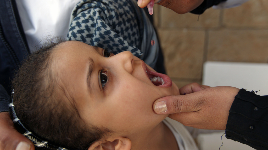 A Yemeni child receives a polio vaccine in the capital city of Sanaa. The Yemen government launched an immunization campaign last month in response to the polio outbreak in neighboring Somalia.