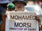 In Cairo on July 17, supporters of the ousted president demonstrate for his reinstatement. In Cairo on July 17, supporters of the ousted president demonstrate for his reinstatement.