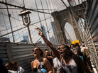 Protesters in support of Trayvon Martin march across the Brooklyn Bridge after attending a rally organized by the Rev. Al Sharpton on Sunday in New York City. Protesters in support of Trayvon Martin march across the Brooklyn Bridge after attending a rally organized by the Rev. Al Sharpton on Sunday in New York City.
