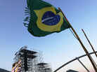 A Brazilian flag flies on Saturday near the podium which will receive Pope Francis on Copacabana Beach in Rio de Janeiro. A Brazilian flag flies on Saturday near the podium which will receive Pope Francis on Copacabana Beach in Rio de Janeiro.
