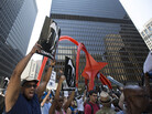 A man holds up a sign at the "Justice for Trayvon" rally in downtown Chicago on Saturday. A man holds up a sign at the "Justice for Trayvon" rally in downtown Chicago on Saturday.