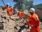 Rescuers clear debris Monday in China's Gansu province, where dozens of people were killed when earthquakes struck the region. Rescuers clear debris Monday in China's Gansu province, where dozens of people were killed when earthquakes struck the region.