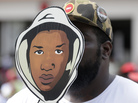 Aqua Etefia holds up a Trayvon Martin mask at a rally Saturday in Miami. Aqua Etefia holds up a Trayvon Martin mask at a rally Saturday in Miami.