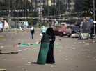 A supporter of Egypt's ousted President Mohammed Morsi holds a mat on Tuesday, where protesters have set up a camp near Cairo University in Giza, Egypt. A supporter of Egypt's ousted President Mohammed Morsi holds a mat on Tuesday, where protesters have set up a camp near Cairo University in Giza, Egypt.