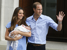 Britain's Prince William, right, and Kate, Duchess of Cambridge hold the Prince of Cambridge on Tuesday as they pose for photographers outside St. Mary's Hospital in London. Britain's Prince William, right, and Kate, Duchess of Cambridge hold the Prince of Cambridge on Tuesday as they pose for photographers outside St. Mary's Hospital in London.