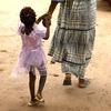 A mother and daughter walk home after attending a community meeting about eradicating female genital mutilation in the western Senegalese village of Diabougo.