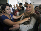 The sister of opposition politician Mohamed Brahmi, mourns at the hospital in Ariana, outside Tunis, after he was gunned down in front of his home, on Thursday. The sister of opposition politician Mohamed Brahmi, mourns at the hospital in Ariana, outside Tunis, after he was gunned down in front of his home, on Thursday.