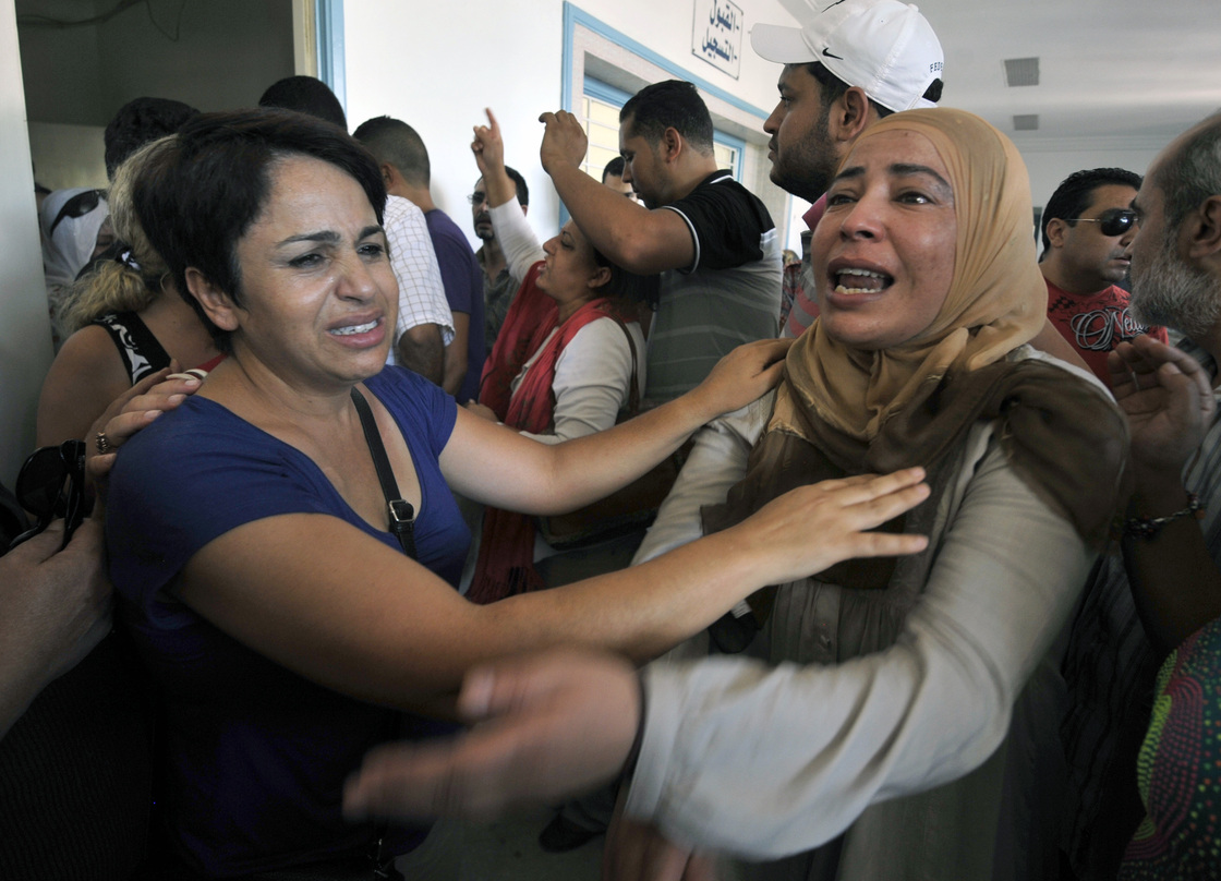The sister of opposition politician Mohamed Brahmi, mourns at the hospital in Ariana, outside Tunis, after he was gunned down in front of his home, on Thursday. The sister of opposition politician Mohamed Brahmi, mourns at the hospital in Ariana, outside Tunis, after he was gunned down in front of his home, on Thursday.