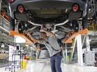 Jeff Caldwell, a chassis assembly line supervisor, checks a vehicle on the assembly line at the Chrysler Jefferson North Assembly plant in Detroit on May 8. Jeff Caldwell, a chassis assembly line supervisor, checks a vehicle on the assembly line at the Chrysler Jefferson North Assembly plant in Detroit on May 8.