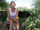 Food bank client Jamie Senik takes a break near her garden plot sponsored by the Community Food Bank of Southern Arizona. She grows food for herself and her diabetic mother. Food bank client Jamie Senik takes a break near her garden plot sponsored by the Community Food Bank of Southern Arizona. She grows food for herself and her diabetic mother.
