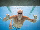 Graham Johnston, 82, poses for a portrait through an underwater window at the pool on Wednesday. Graham competed at the Senior Games in Cleveland, where more than 10,000 athletes older than 55 are competing in various sports. Graham Johnston, 82, poses for a portrait through an underwater window at the pool on Wednesday. Graham competed at the Senior Games in Cleveland, where more than 10,000 athletes older than 55 are competing in various sports.
