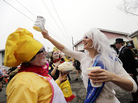 Jill Pasquarella (right) pours powdered sugar on Brandon Connelly, who dressed as a baker from Hubig's Pies, during Mardi Gras in New Orleans in February. Jill Pasquarella (right) pours powdered sugar on Brandon Connelly, who dressed as a baker from Hubig's Pies, during Mardi Gras in New Orleans in February.