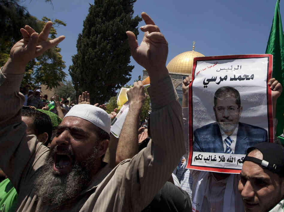 Supporters of deposed Egyptian President Mohamed Morsi attend a Friday rally in Cairo. Supporters of deposed Egyptian President Mohamed Morsi attend a Friday rally in Cairo.