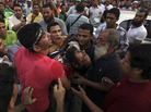 Supporters of Egypt's ousted President Mohammed Morsi carry an injured man to a field hospital following clashes with security forces at Nasr City. Supporters of Egypt's ousted President Mohammed Morsi carry an injured man to a field hospital following clashes with security forces at Nasr City.