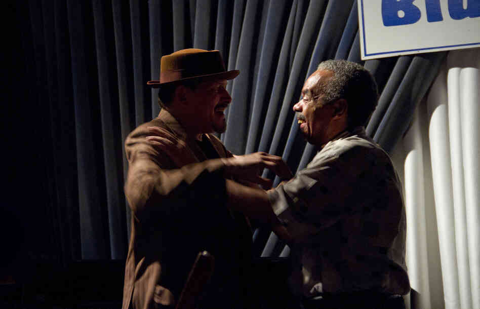 Jerry González and Steve Berrios embrace at a July 2013 performance by the Fort Apache Band. Jerry González and Steve Berrios embrace at a July 2013 performance by the Fort Apache Band.