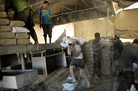 Workers in the Gaza Strip load a truck with sacks of cement that arrived via a smuggling tunnel from Egypt. Gazan officials say the Egyptian military has cracked down on smuggling tunnels that bring many goods into Gaza. Workers in the Gaza Strip load a truck with sacks of cement that arrived via a smuggling tunnel from Egypt. Gazan officials say the Egyptian military has cracked down on smuggling tunnels that bring many goods into Gaza.