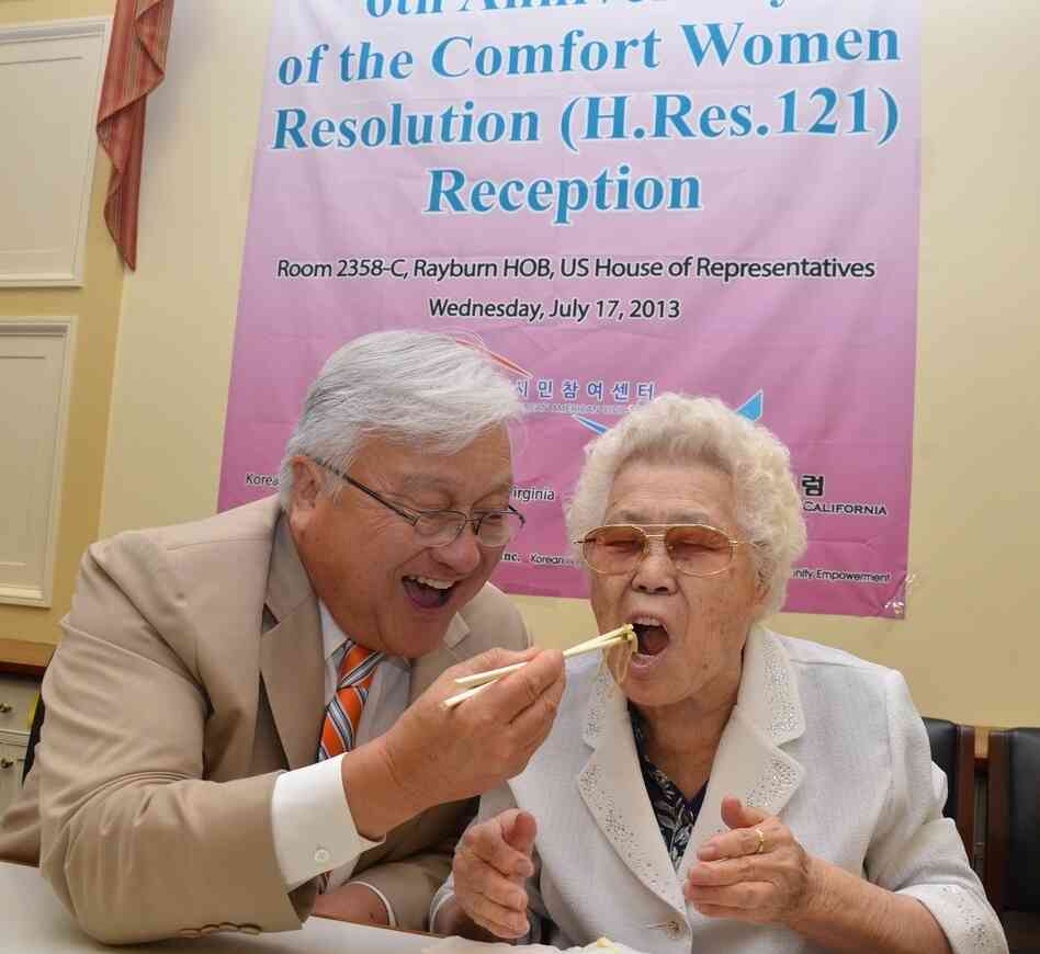 Rep. Mike Honda, D-Calif., and Ok-seon Lee, who says she was forced into sex slavery during World War II, celebrate the anniversary of a 2007 House resolution that asks the Japanese government to apologize to comfort women. Rep. Mike Honda, D-Calif., and Ok-seon Lee, who says she was forced into sex slavery during World War II, celebrate the anniversary of a 2007 House resolution that asks the Japanese government to apologize to comfort women.