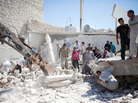 Syrians search for survivors under the rubble of a destroyed house after a barrel bomb was dropped from an air force helicopter in Saraqeb on July 20. Syrians search for survivors under the rubble of a destroyed house after a barrel bomb was dropped from an air force helicopter in Saraqeb on July 20.