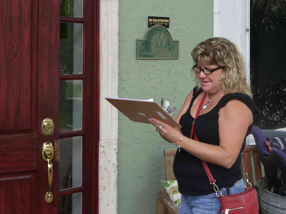 Volunteer Tammy Spencer goes door to door in Boca Raton., Fla., on July 27 to spread the word on the state's health exchange. Volunteer Tammy Spencer goes door to door in Boca Raton., Fla., on July 27 to spread the word on the state's health exchange.
