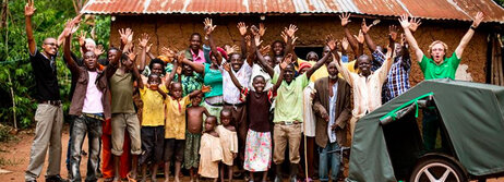 Local villagers, health workers, AIDS orphans and CA Bikes staffers celebrate the delivery ofa bike ambulance  to Barr Village in northern Uganda.