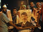 Egyptian supporters of ousted President Mohammed Morsi demonstrate against the military-backed government in Cairo. Morsi, who has been detained since July 3, is in good health, a European official says. Egyptian supporters of ousted President Mohammed Morsi demonstrate against the military-backed government in Cairo. Morsi, who has been detained since July 3, is in good health, a European official says.