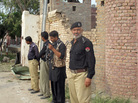 Pakistani policemen stand outside the central prison after an overnight attack in Dera Ismail Khan. Officials say Taliban insurgents freed hundreds of prisoners, including hard-line militants. Pakistani policemen stand outside the central prison after an overnight attack in Dera Ismail Khan. Officials say Taliban insurgents freed hundreds of prisoners, including hard-line militants.