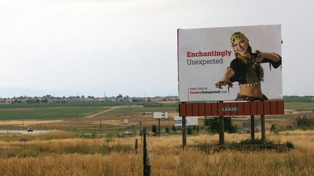As part of its rebranding effort, Greeley has adopted the slogan 'Greeley Unexpected,' appearing on a billboard on Highway 34 in Weld County, Colo. (Image credit: Nathan Heffel for NPR)