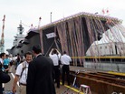 Japan's new warship, the Izumo, draws a crowd for its launch ceremony at the port in Yokohama Tuesday. At 248 meters (814 feet) in length, the flat-topped ship has been called a destroyer, or a helicopter carrier. Japan's new warship, the Izumo, draws a crowd for its launch ceremony at the port in Yokohama Tuesday. At 248 meters (814 feet) in length, the flat-topped ship has been called a destroyer, or a helicopter carrier.