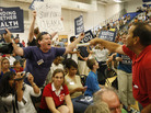 Members of the audience argue before a town hall forum on the health care overhaul hosted by Rep. Jim Moran, D-Va., and former Democratic National Committee Chairman Howard Dean, in Reston, Va., on Aug. 25, 2009. Members of the audience argue before a town hall forum on the health care overhaul hosted by Rep. Jim Moran, D-Va., and former Democratic National Committee Chairman Howard Dean, in Reston, Va., on Aug. 25, 2009.