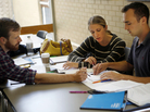 From left, Garrett Berntsen, Jennifer Majer and William Shields compare notes at The Johns Hopkins University School of Advanced International Studies in Washington, D.C. Twenty-somethings have new choices under Obamacare. From left, Garrett Berntsen, Jennifer Majer and William Shields compare notes at The Johns Hopkins University School of Advanced International Studies in Washington, D.C. Twenty-somethings have new choices under Obamacare.