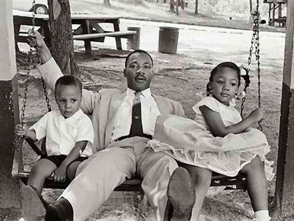 Martin Luther King Jr sits on a swing with his eldest daughter, Yolanda, and eldest son, Martin, at an amusement park he helped desegregate. Martin Luther King Jr sits on a swing with his eldest daughter, Yolanda, and eldest son, Martin, at an amusement park he helped desegregate.