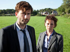 David Tennant plays Detective Inspector Alec Hardy alongside Olivia Colman as Detective Sergeant Ellie Miller, investigating the murder of a young boy in the BBC crime drama Broadchurch. David Tennant plays Detective Inspector Alec Hardy alongside Olivia Colman as Detective Sergeant Ellie Miller, investigating the murder of a young boy in the BBC crime drama Broadchurch.