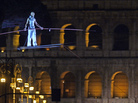 Tightrope walker Andrea Loreni performs in front of the Coliseum in Rome on Saturday. Rome's new mayor is on a crusade to make the ancient monuments more pedestrian friendly, and the city held an all-night street party as it permanently blocked off part of the main road running past the Coliseum. Tightrope walker Andrea Loreni performs in front of the Coliseum in Rome on Saturday. Rome's new mayor is on a crusade to make the ancient monuments more pedestrian friendly, and the city held an all-night street party as it permanently blocked off part of the main road running past the Coliseum.