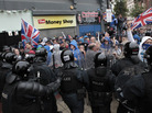 Loyalist protesters clash with riot police in the center of Belfast, Northern Ireland, on Friday. Loyalist protesters clash with riot police in the center of Belfast, Northern Ireland, on Friday.