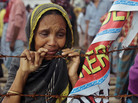 A Bangladeshi woman cries on Aug. 2 at the site of Rana Plaza building collapse near Dhaka, Bangladesh. The building came crashing down in April, the worst tragedy in the history of the global garment industry. A Bangladeshi woman cries on Aug. 2 at the site of Rana Plaza building collapse near Dhaka, Bangladesh. The building came crashing down in April, the worst tragedy in the history of the global garment industry.