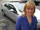 Sara Busch of Havertown, Pa., owns a Chevy Volt, an electric hybrid. Like a lot of Americans, she's buying less gasoline than she used to, which means she's paying less in gas taxes. Sara Busch of Havertown, Pa., owns a Chevy Volt, an electric hybrid. Like a lot of Americans, she's buying less gasoline than she used to, which means she's paying less in gas taxes.