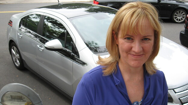 Sara Busch of Havertown, Pa., owns a Chevy Volt, an electric hybrid. Like a lot of Americans, she's buying less gasoline than she used to, which means she's paying less in gas taxes. (Image credit: NPR)