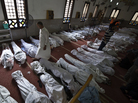 A man walks among shrouded bodies at a Cairo mosque on Thursday. At the El-Iman mosque, more than 200 bodies were being prepared for burial, the victims killed in a crackdown on protesters by Egypt's military-backed government. A man walks among shrouded bodies at a Cairo mosque on Thursday. At the El-Iman mosque, more than 200 bodies were being prepared for burial, the victims killed in a crackdown on protesters by Egypt's military-backed government.