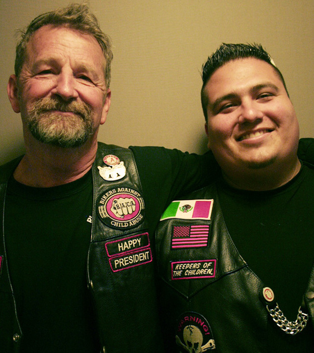 Happy Dodson (left) and Taz Roman are president and treasurer, respectively, of the Connecticut chapter of Bikers Against Child Abuse. (Image credit: StoryCorps)
