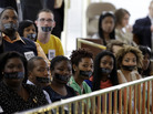 Opponents of North Carolina's new voter ID legislation wear tape over their mouths while sitting in the gallery of the House chamber of the North Carolina General Assembly in Raleigh, N.C., on April 24, where lawmakers debated new voter laws. On Monday, Gov. Pat McCrory signed a new law that requires a state-approved photo ID to vote and cuts early-voting opportunities. Opponents of North Carolina's new voter ID legislation wear tape over their mouths while sitting in the gallery of the House chamber of the North Carolina General Assembly in Raleigh, N.C., on April 24, where lawmakers debated new voter laws. On Monday, Gov. Pat McCrory signed a new law that requires a state-approved photo ID to vote and cuts early-voting opportunities.