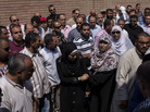 Mourners attend the funeral of Ammar Badie, son of the Muslim Brotherhood's Supreme Guide, at the Katameya cemetery in the New Cairo district on Sunday. Badie was killed in clashes with security forces. Mourners attend the funeral of Ammar Badie, son of the Muslim Brotherhood's Supreme Guide, at the Katameya cemetery in the New Cairo district on Sunday. Badie was killed in clashes with security forces.