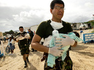 In Haiti, an Argentinean U.N. doctor carries a sick baby to a helicopter, to be taken to Port-au-Prince for treatment. The photo is part of a gallery honoring World Humanitarian Day. In Haiti, an Argentinean U.N. doctor carries a sick baby to a helicopter, to be taken to Port-au-Prince for treatment. The photo is part of a gallery honoring World Humanitarian Day.