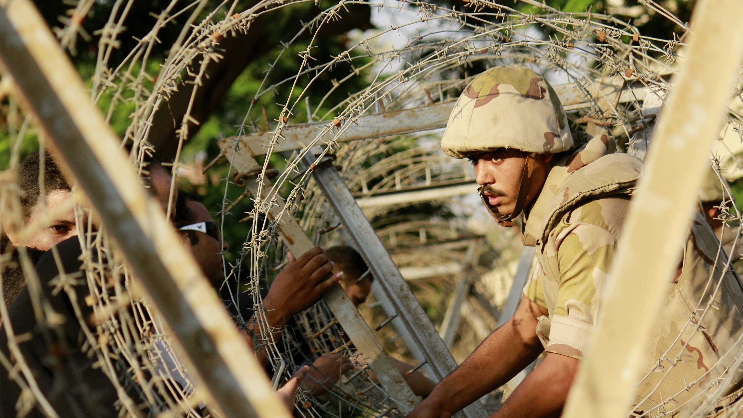 In Cairo, soldiers have put barbed wire around the constitutional court, one of many government institutions under guard. In Cairo, soldiers have put barbed wire around the constitutional court, one of many government institutions under guard.