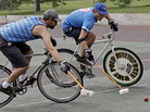 Jacob Newborn takes a shot past Lodewijk Broekhuizen (left) during a bike polo practice session in Milwaukee. Jacob Newborn takes a shot past Lodewijk Broekhuizen (left) during a bike polo practice session in Milwaukee.