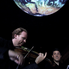 Violinist Daniel Hope takes his music of the spheres concept to the Center for Earth and Space at the American Museum of Natural History. Violinist Daniel Hope takes his music of the spheres concept to the Center for Earth and Space at the American Museum of Natural History.