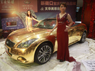 Models pose with a gold-plated Infiniti luxury sports car on display at a jewelry store in Nanjing, in east China's Jiangsu province, in 2011. Models pose with a gold-plated Infiniti luxury sports car on display at a jewelry store in Nanjing, in east China's Jiangsu province, in 2011.