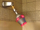 The Uji shower head will be available for sale in early 2014. Its light turns from green to red as the shower progresses. The Uji shower head will be available for sale in early 2014. Its light turns from green to red as the shower progresses.