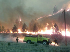 Firefighters stand watch near the perimeter of the Elk Complex fire near the small mountain community of Pine, Idaho, on Aug. 12. The lightning-caused fire is one of many burning through states in the Western U.S. Firefighters stand watch near the perimeter of the Elk Complex fire near the small mountain community of Pine, Idaho, on Aug. 12. The lightning-caused fire is one of many burning through states in the Western U.S.